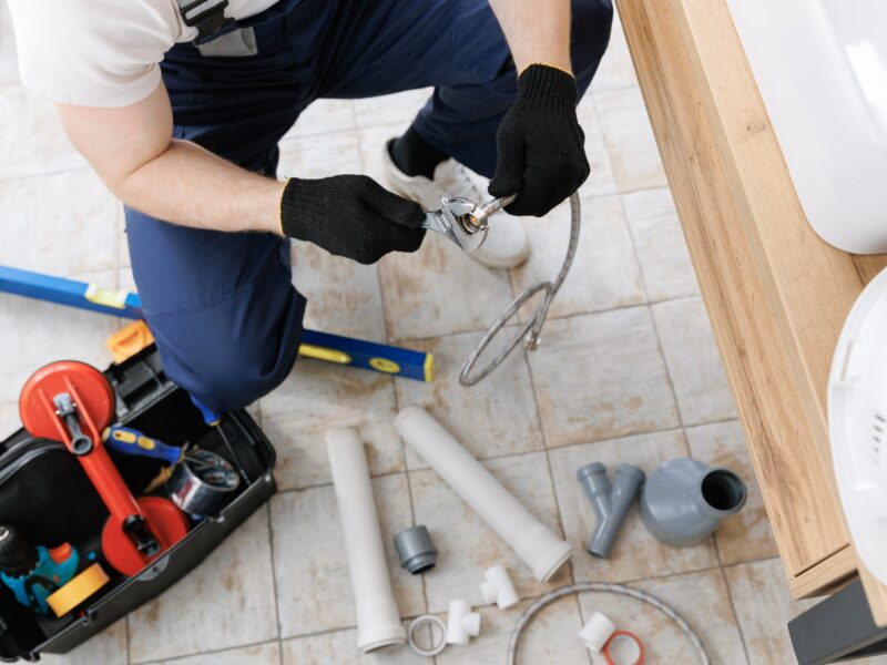 Plumber,Man,At,Work,In,Bathroom,,Fix,Repair,Service.,Concept